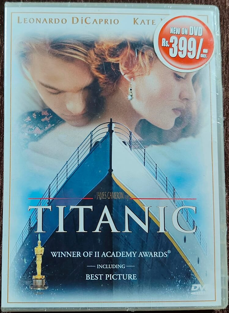 Titanic (1997) Directed by James Cameron & Music by James Horner Rahman Mainstream English Movie Pre-Owned Excel Home Videos DVD